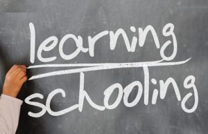 Learning schooling written on chalkboard
