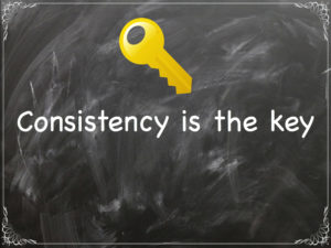 Consistency is the key written on chalkboard
