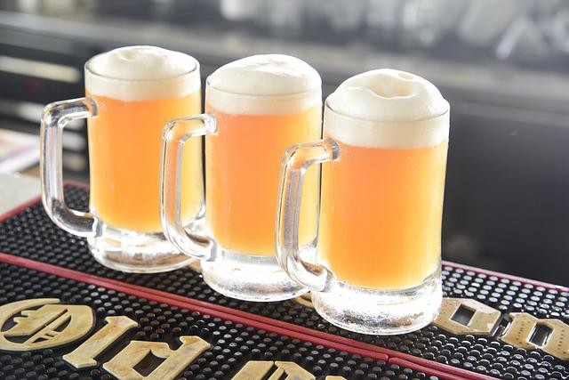 Three glasses of beer placed on the table.