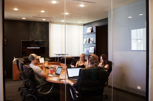 A group of employees discussing about the working trends.