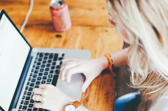 Woman working on her laptop from home.