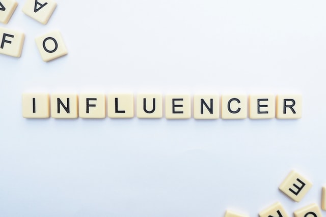 Influencer word been formed with letter blocks.