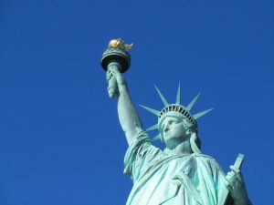 The statue of liberty with a torch in the hand