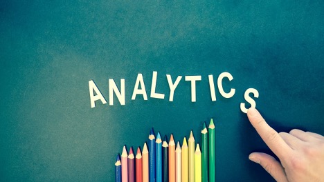 The word Analytics with colorful pencils.