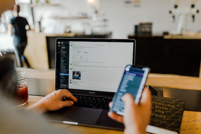 A man looking into his mobile whilst working.