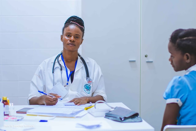 A medical representative taking care of an ill patient.