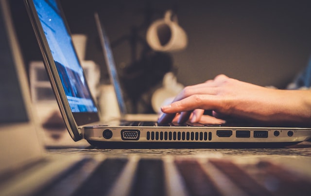 Man is checking whether his laptop has fast and reliable internet access.