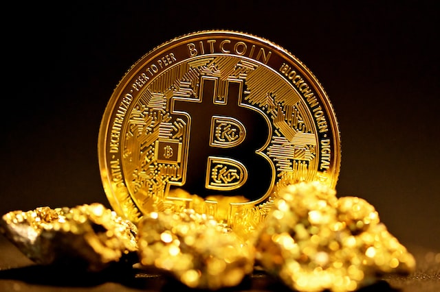 A golden bitcoin with Letter B engraved on it.