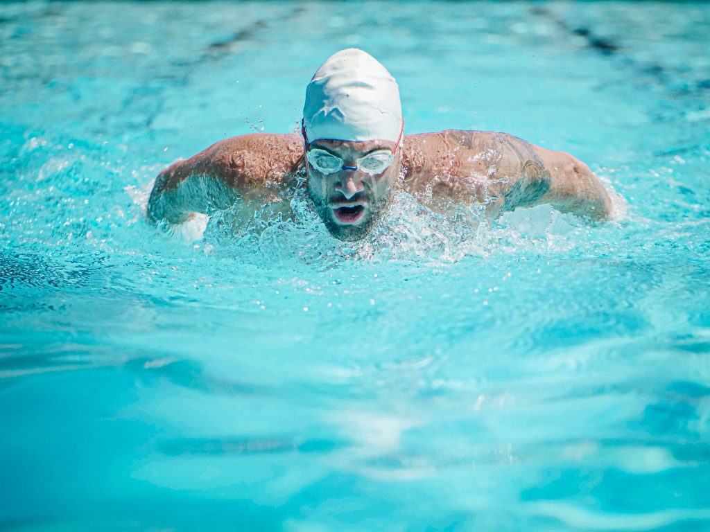 A man swimming in the pool.