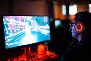 A man playing video games on desktop.