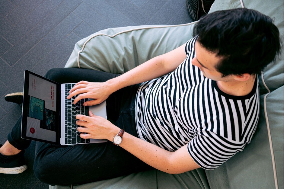 A man working on the laptop.