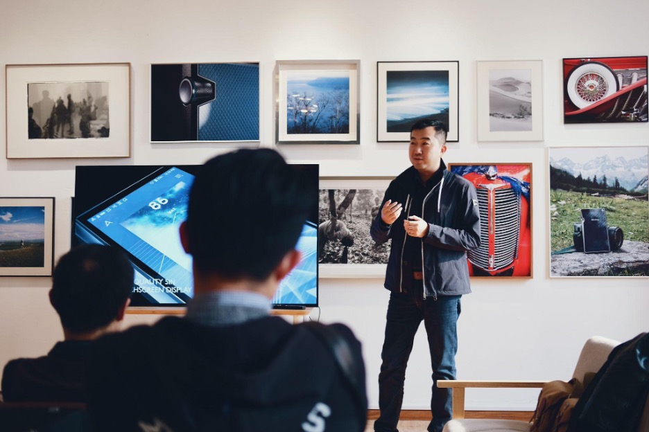 A man giving an Influencial speech to its audience.