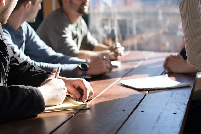 A group of people discussing.