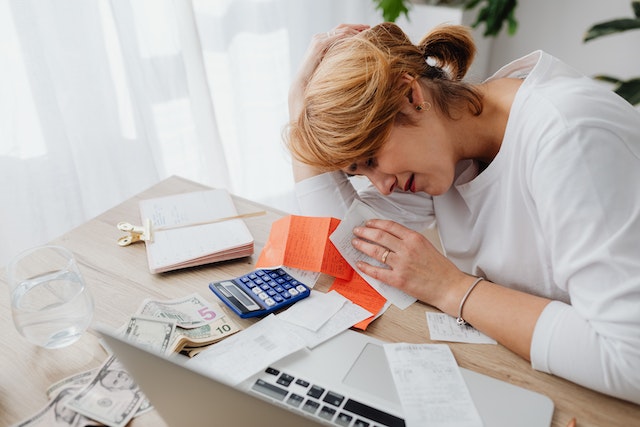 A woman in Financial Stress.