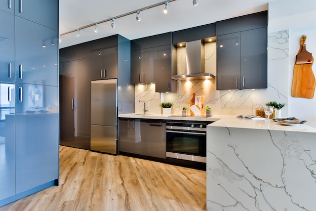 A kitchen with cabinets, drawers and lightings.