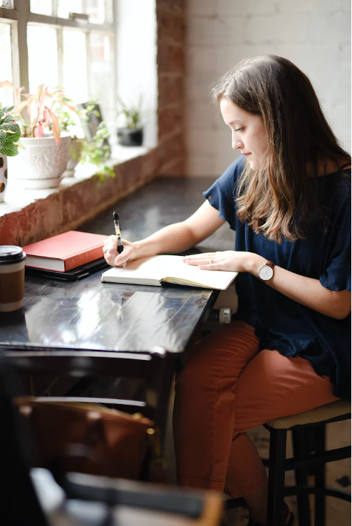 A woman writing an essay.