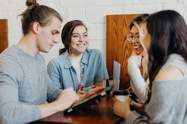 Employees talking in a group.